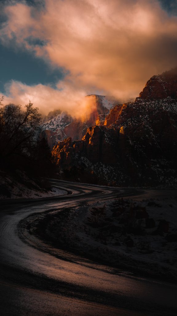 A roadway in the middle of rocky mountains - Zion National Park, Utah.