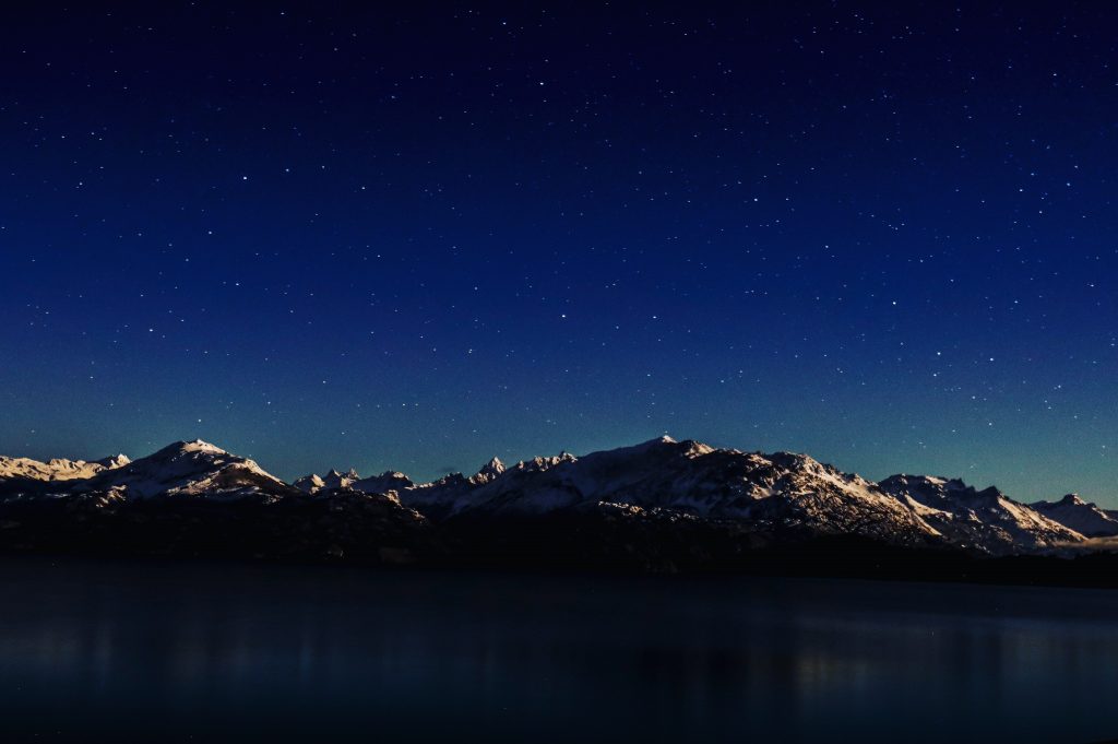 Night sky over Chile's New Patagonia Park Trail, mountains in the distance.